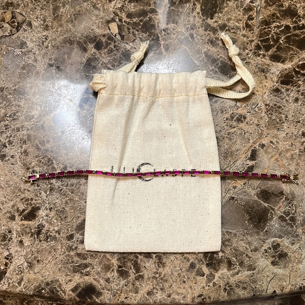 Lili claspe Gigi baguette red stone tennis bracelet.
